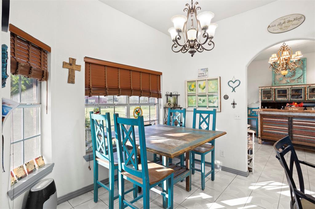 6524 Fair Road Kaufman, TX 75142 - Photo 10 of 30 a view of a dining room with furniture and a chandelier