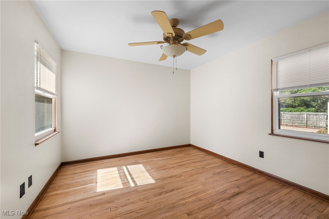 18122 Nottingham Road Cleveland, OH 44119 - Photo 14 of 29 Bedroom with light wood-type flooring, plenty of natural light, and ceiling fan