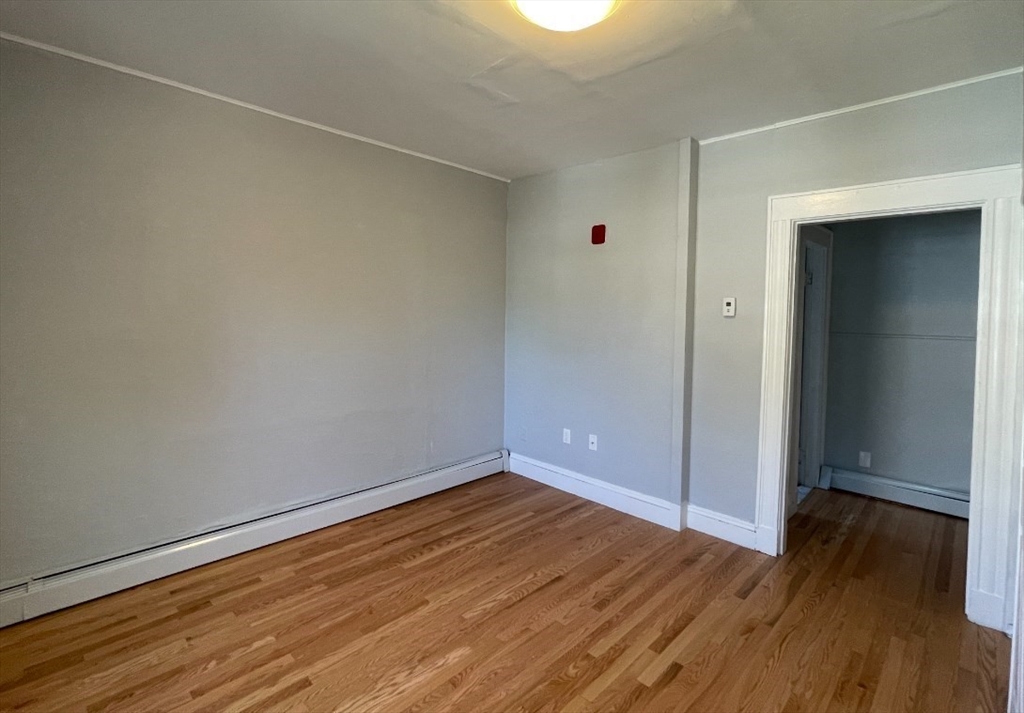 233 Lafayette Street, Unit 4 Salem, MA 01970 - Photo 4 of 8 a view of a room with wooden floor