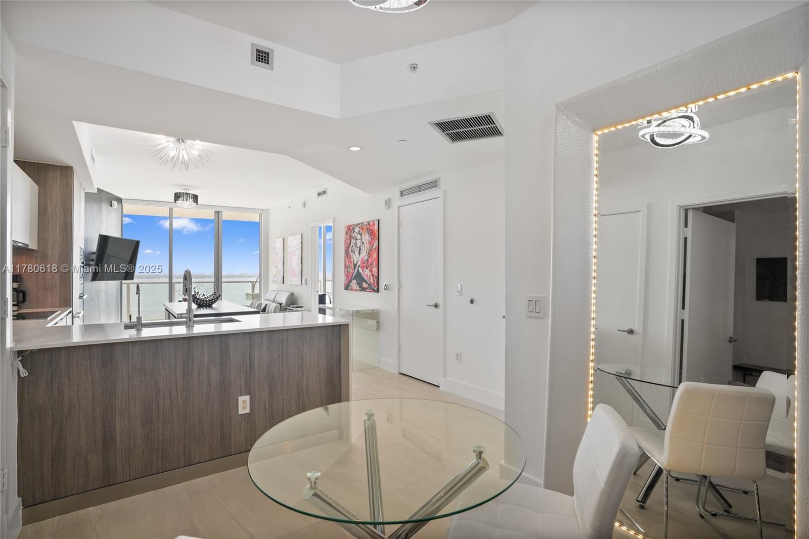 2900 Northeast 7th Avenue, Unit 1905 Miami, FL 33137 - Photo 11 of 82 a kitchen with stainless steel appliances kitchen island granite countertop a sink and cabinets