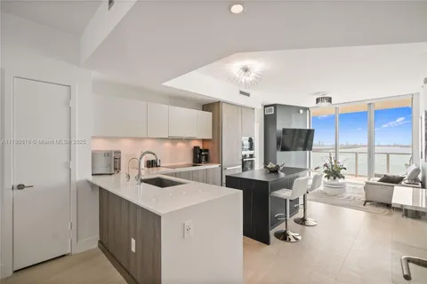 a kitchen that has a lot of cabinets in it