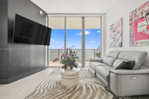 a bedroom with a bed and a chair