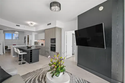 a bedroom with a bed and glass door