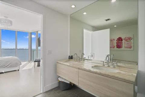 a view of an entryway with wooden floor and windows