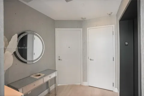 a bathroom with a toilet a sink and a mirror