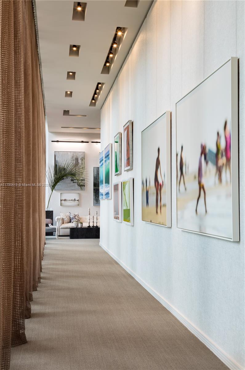 2900 Northeast 7th Avenue, Unit 1905 Miami, FL 33137 - Photo 64 of 82 a view of a hallway with a painting on the wall