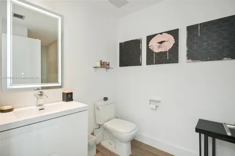 a kitchen with stainless steel appliances kitchen island granite countertop a sink and cabinets