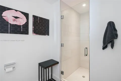 a kitchen with a stove a refrigerator a sink dishwasher with a dining table and chairs