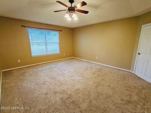 a bathroom with a tub a sink and a mirror