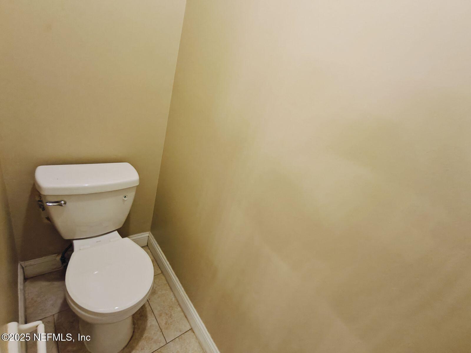 1845 Weston Circle Fleming Island, FL 32003 - Photo 21 of 36 a white toilet sitting next to a white wall
