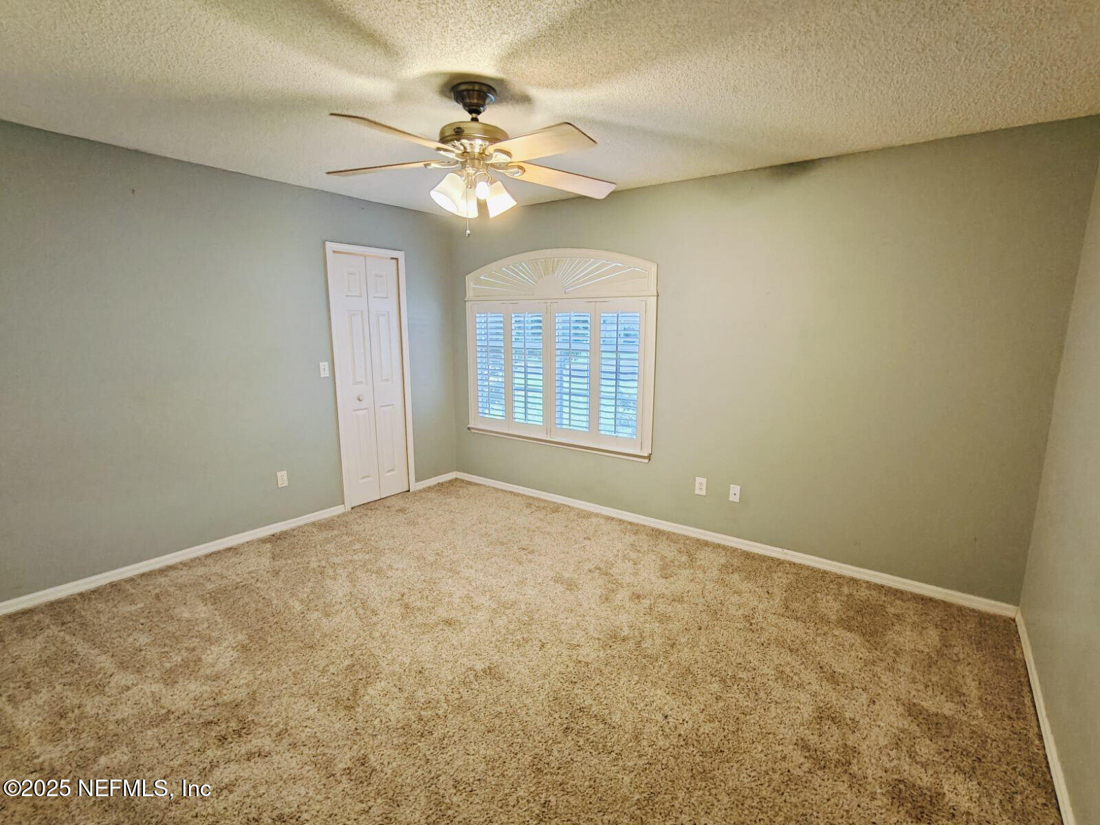 1845 Weston Circle Fleming Island, FL 32003 - Photo 23 of 36 a view of an empty room with a chandelier fan