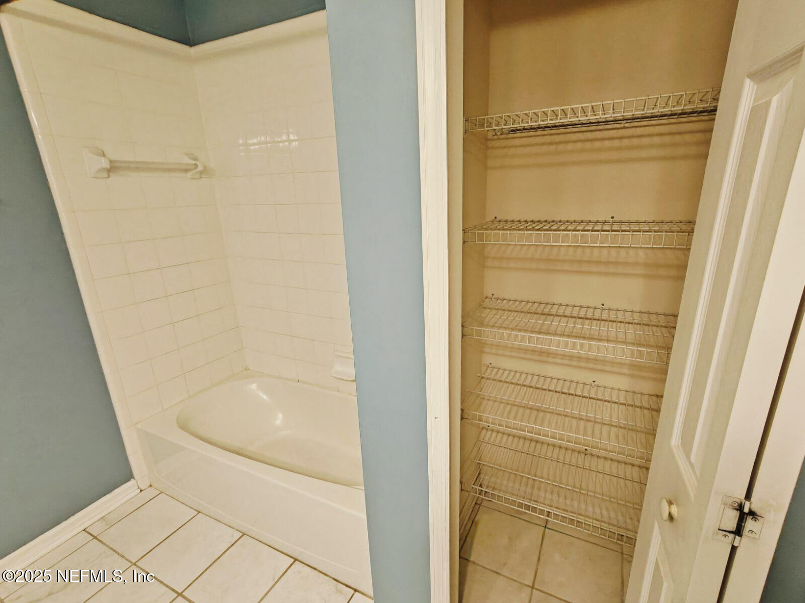 1845 Weston Circle Fleming Island, FL 32003 - Photo 27 of 36 a bathroom with a bathtub