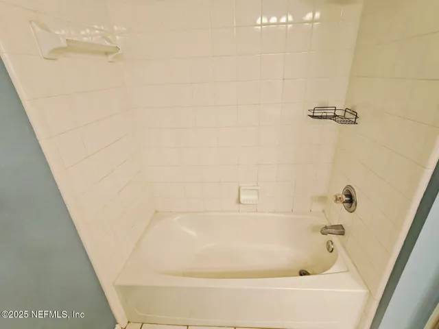 a view of a chandelier fan in a room