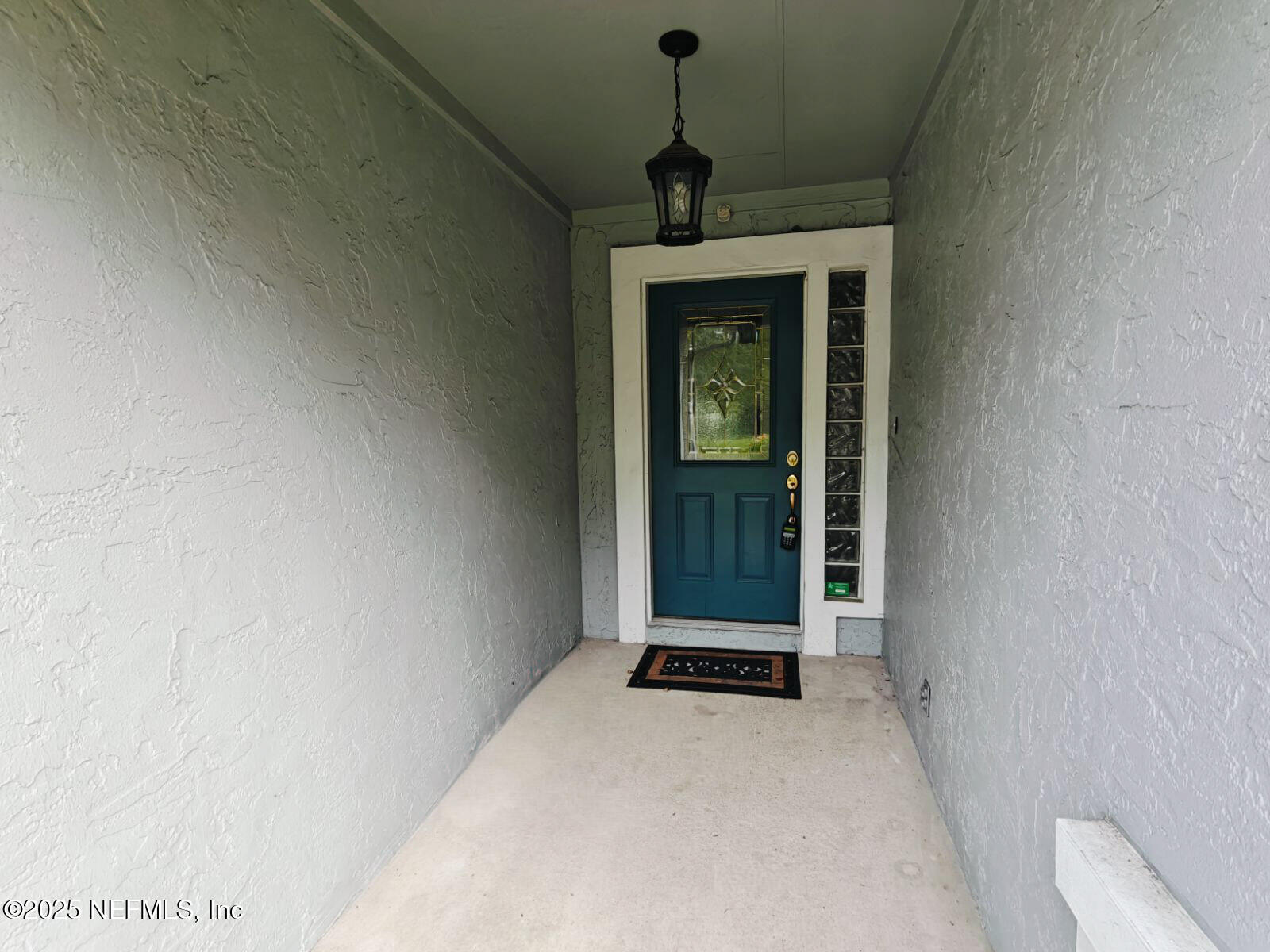 1845 Weston Circle Fleming Island, FL 32003 - Photo 3 of 36 a living room with a window and a ceiling fan