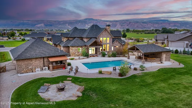 an aerial view of a house with a garden and a yard