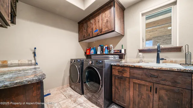 a view of a hallway with wooden floor and stairs