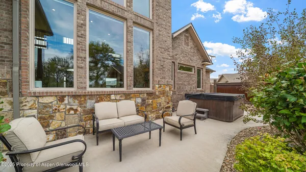 a view of a patio with table and chairs with wooden floor