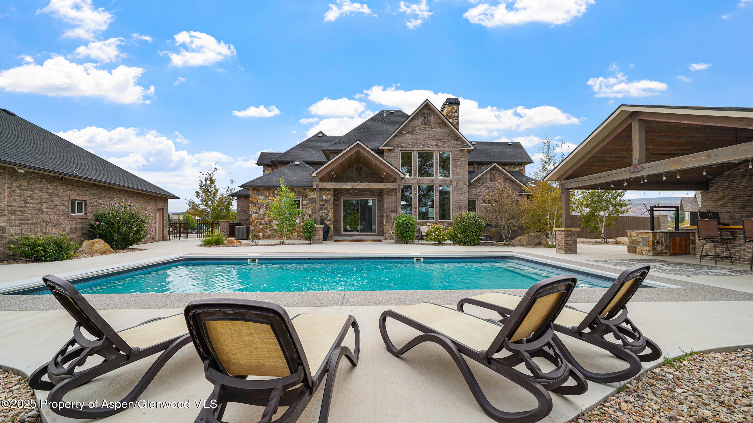 1980 Alabama Boy Court Fruita, CO 81521 - Photo 36 of 52 a view of a patio with table and chairs with wooden floor