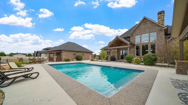 a front view of house with yard and outdoor seating