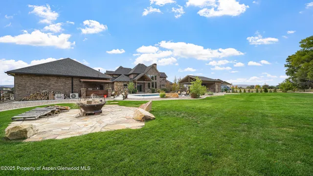 an aerial view of a house with garden space and street view