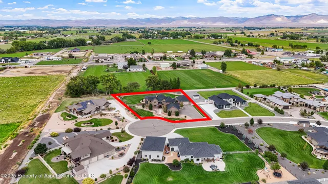 an aerial view of multiple house outdoor space and street view