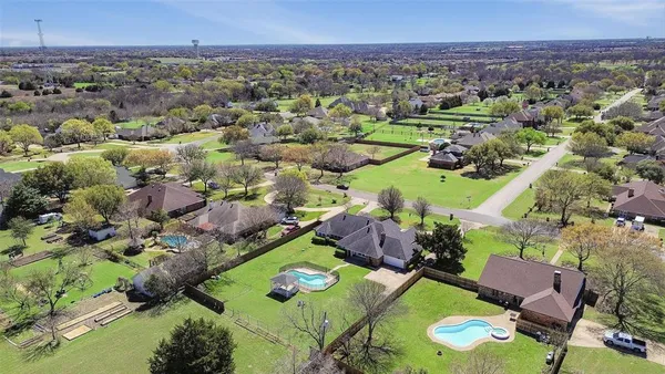 an aerial view of a house with a garden