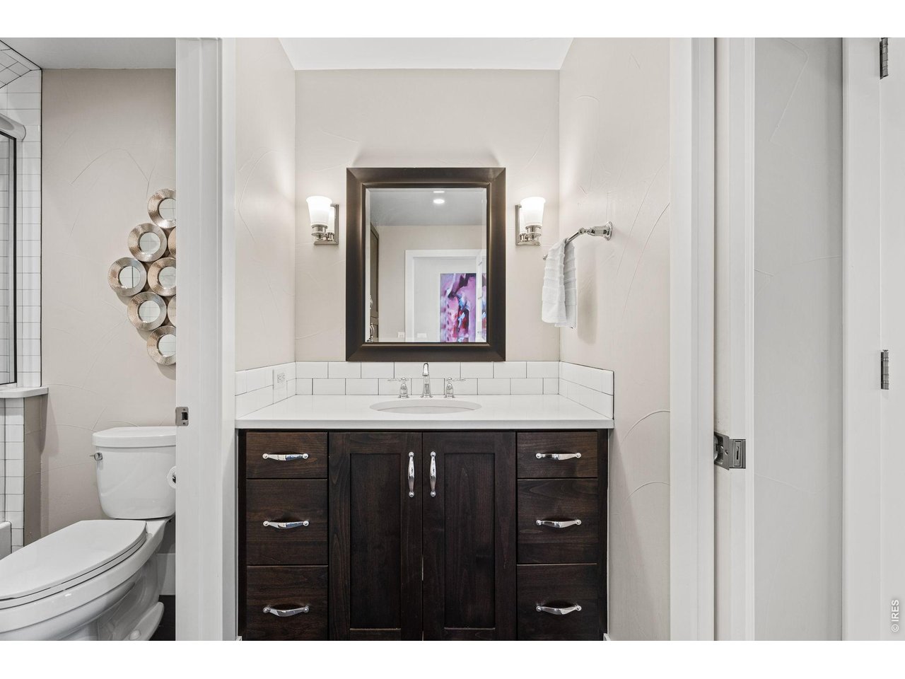 315 North Howes Street Fort Collins, CO 80521 - Photo 33 of 43 a bathroom with a granite countertop sink vanity mirror and toilet