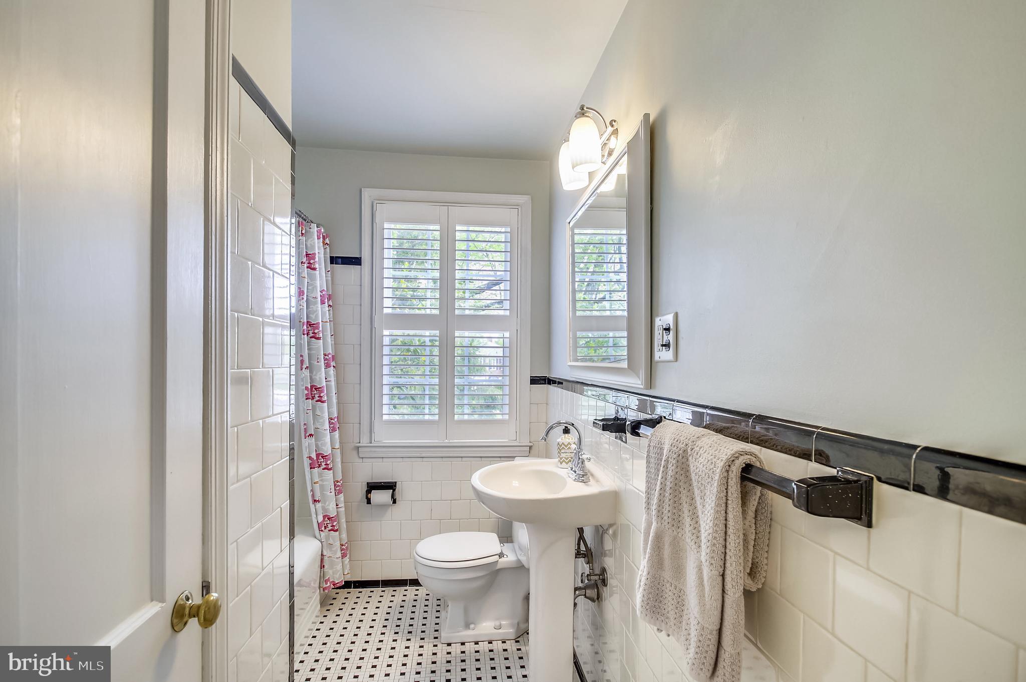 304 Stanmore Road Baltimore, MD 21212 - Photo 14 of 20 a bathroom with a sink toilet and shower