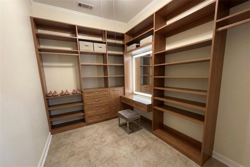 3763 Elkridge Drive Decatur, GA 30032 - Photo 18 of 20 a view of walk in closet with empty racks