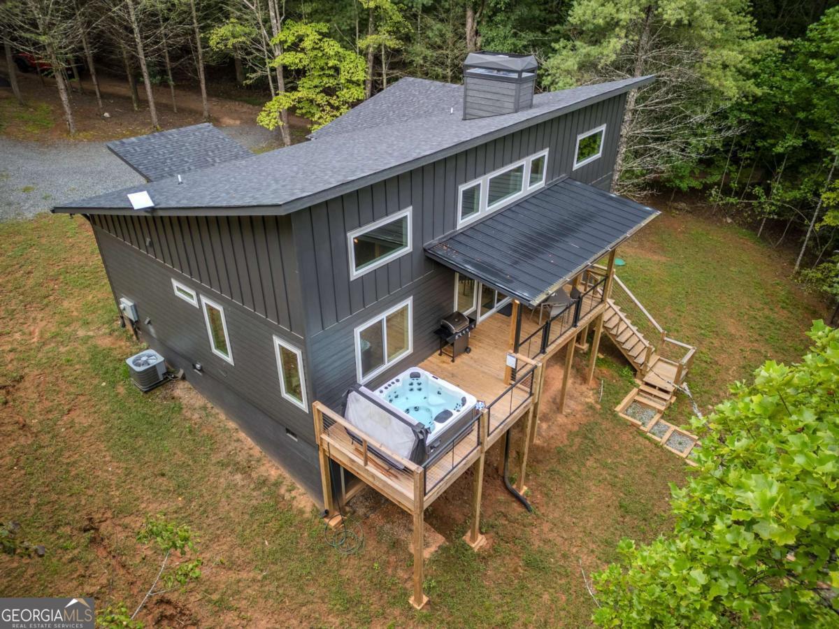1421 Kelly Ridge Drive, Unit 28 Blue Ridge, GA 30513 - Photo 1 of 39 a view of a house with pool and a yard