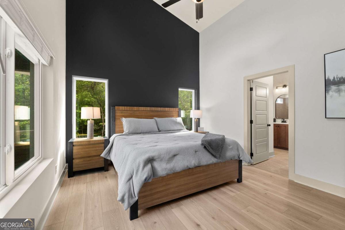 1421 Kelly Ridge Drive, Unit 28 Blue Ridge, GA 30513 - Photo 12 of 39 a bedroom with a bed and wooden floor