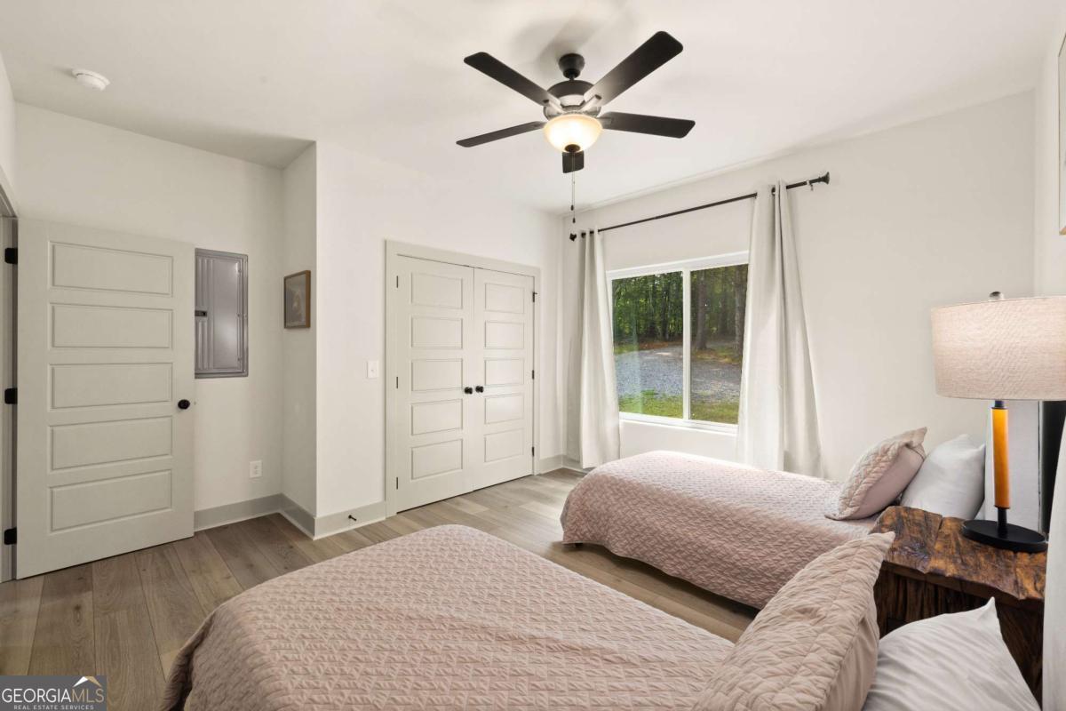 1421 Kelly Ridge Drive, Unit 28 Blue Ridge, GA 30513 - Photo 17 of 39 a bedroom with a large bed and a window