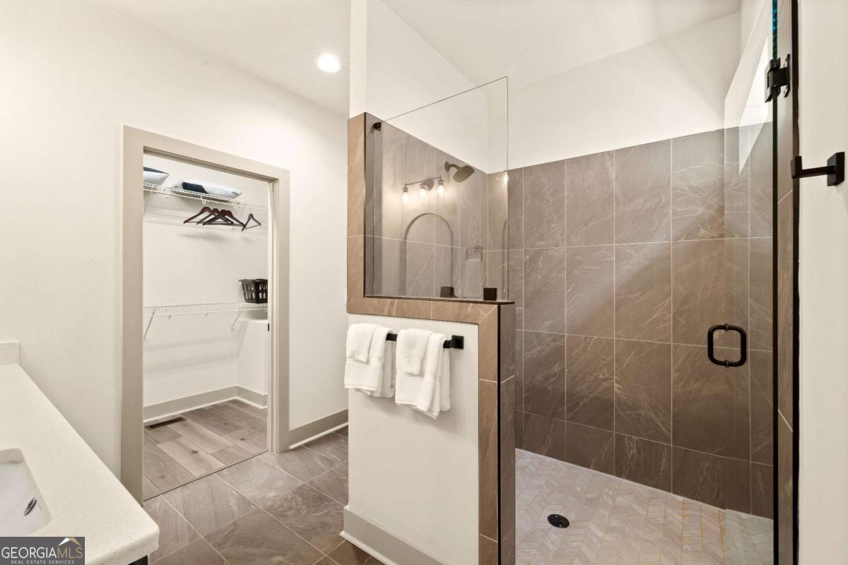 1421 Kelly Ridge Drive, Unit 28 Blue Ridge, GA 30513 - Photo 18 of 39 a bathroom with a shower a sink and a mirror