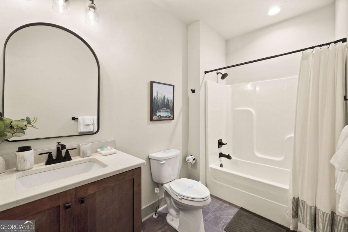1421 Kelly Ridge Drive, Unit 28 Blue Ridge, GA 30513 - Photo 20 of 39 a bathroom with a sink toilet and shower
