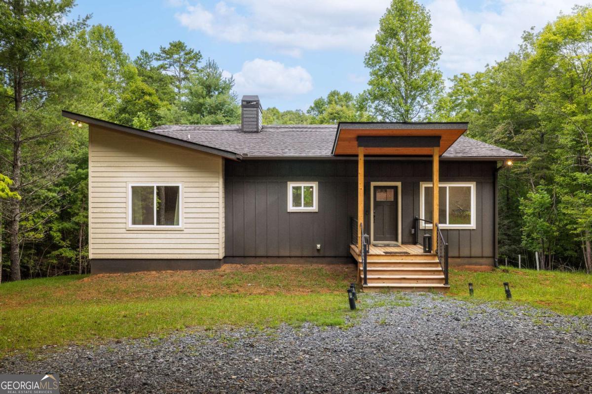 1421 Kelly Ridge Drive, Unit 28 Blue Ridge, GA 30513 - Photo 3 of 39 a front view of a house with garden