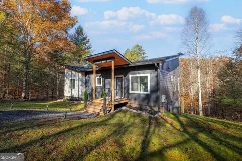 a view of a house with brick walls