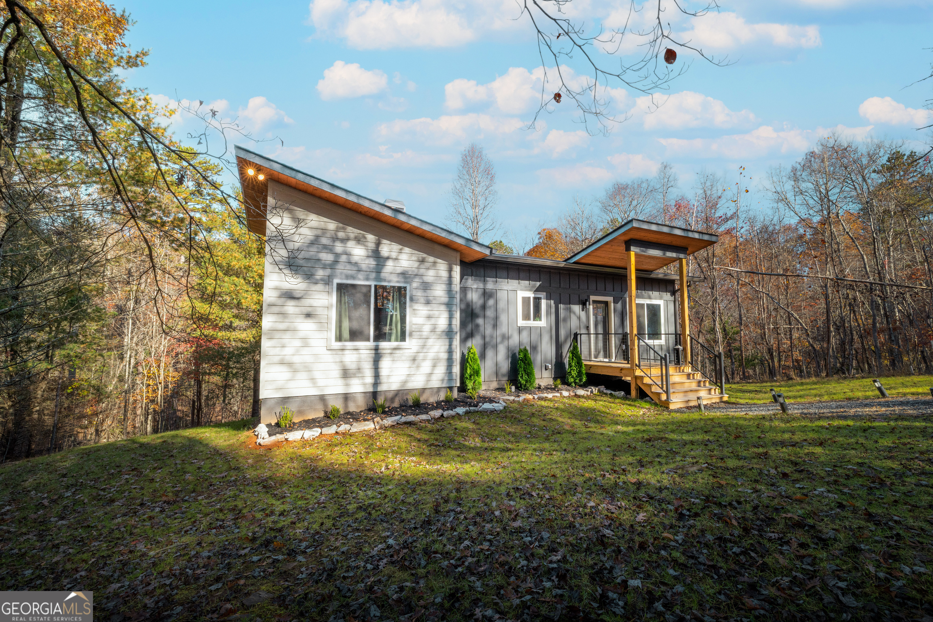 1421 Kelly Ridge Drive, Unit 28 Blue Ridge, GA 30513 - Photo 36 of 39 a front view of a house with a yard and trees