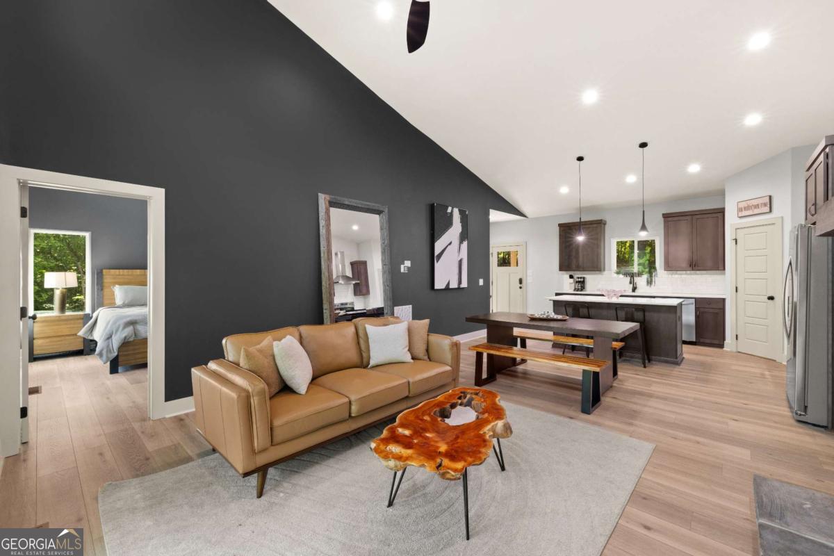 1421 Kelly Ridge Drive, Unit 28 Blue Ridge, GA 30513 - Photo 6 of 39 a living room with furniture and a table