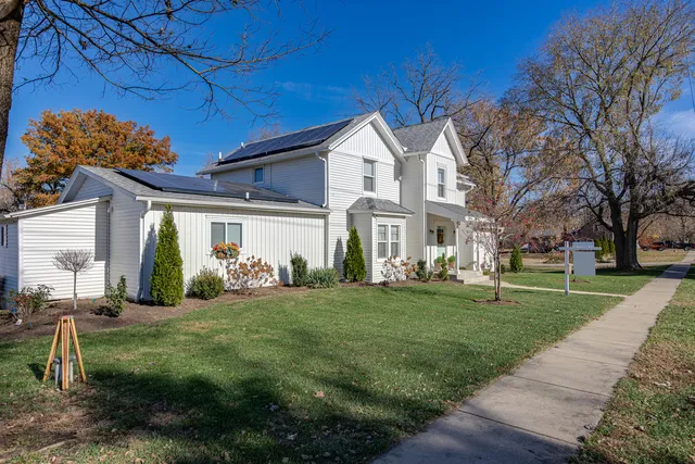 a front view of a house with a yard
