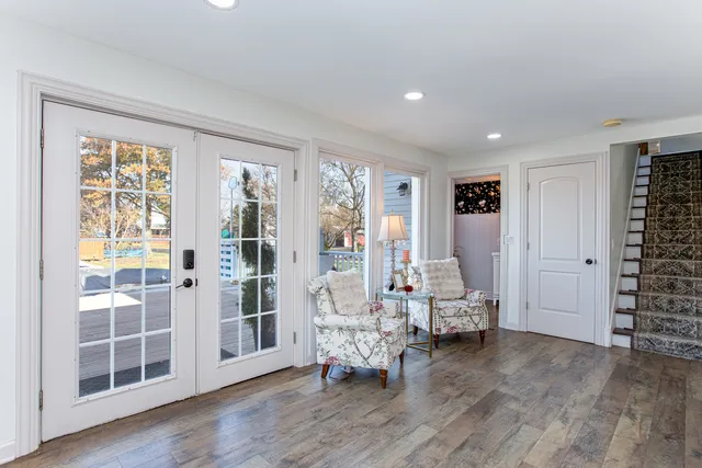 a living room with furniture and wooden floor