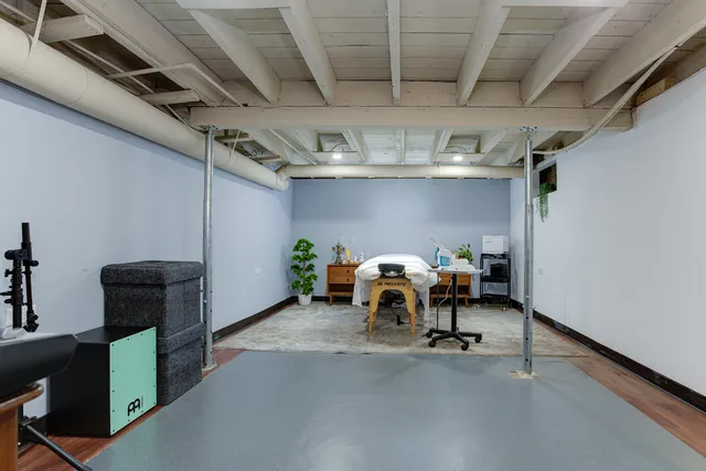 a view of a room with furniture and chandelier