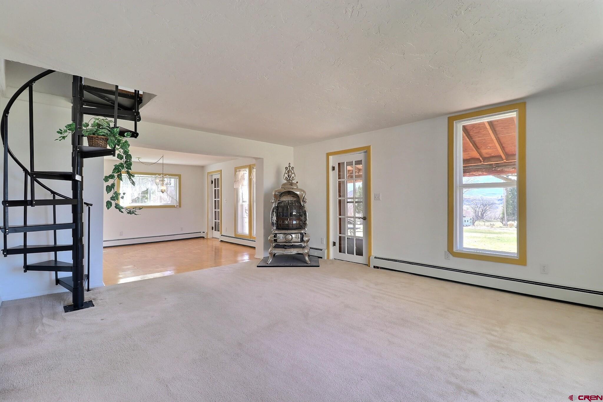 39599 Pitkin Road Paonia, CO 81428 - Photo 20 of 43 an empty room with windows and closet