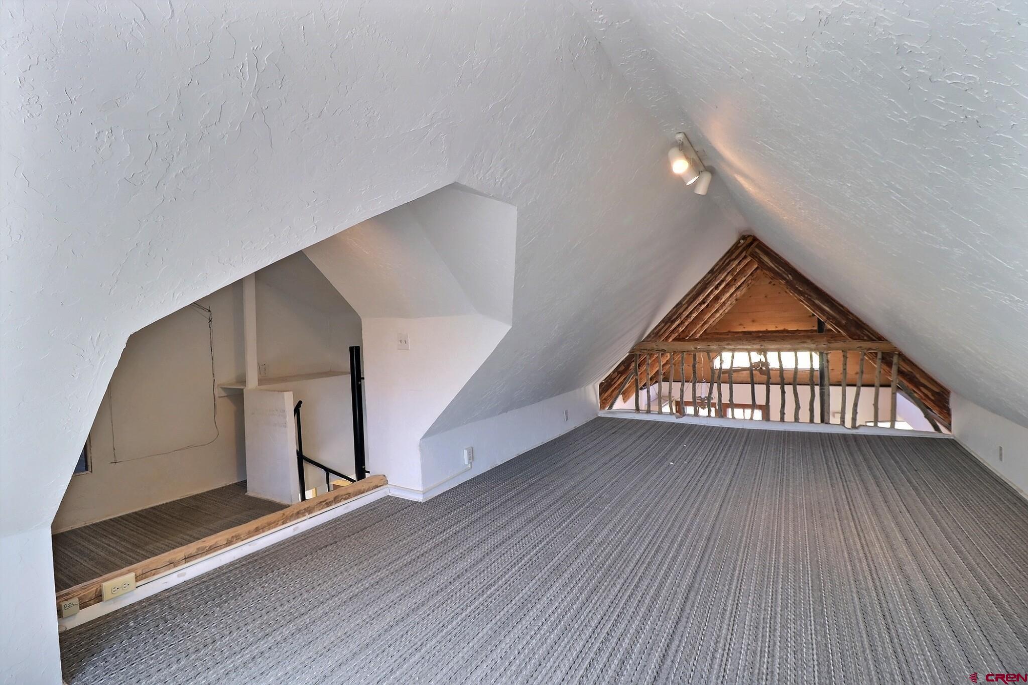 39599 Pitkin Road Paonia, CO 81428 - Photo 32 of 43 a view of an empty room with wooden floor and a window