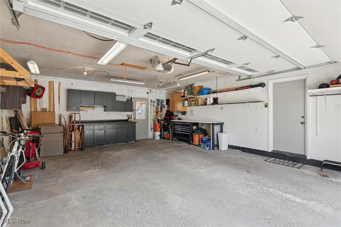 8191 Edgewood Road Mentor, OH 44060 - Photo 36 of 44 Attached 2-car garage with easy-access pull-down storage for added organization and convenience