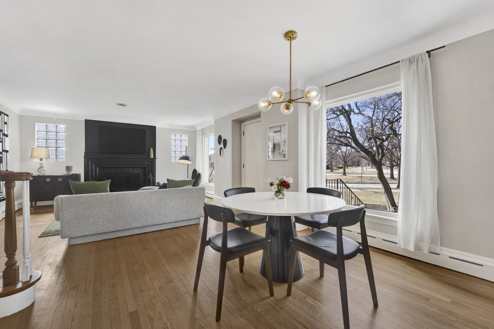 221 Akenside Road Riverside, IL 60546 - Photo 10 of 44 a view of a dining room with furniture window and wooden floor