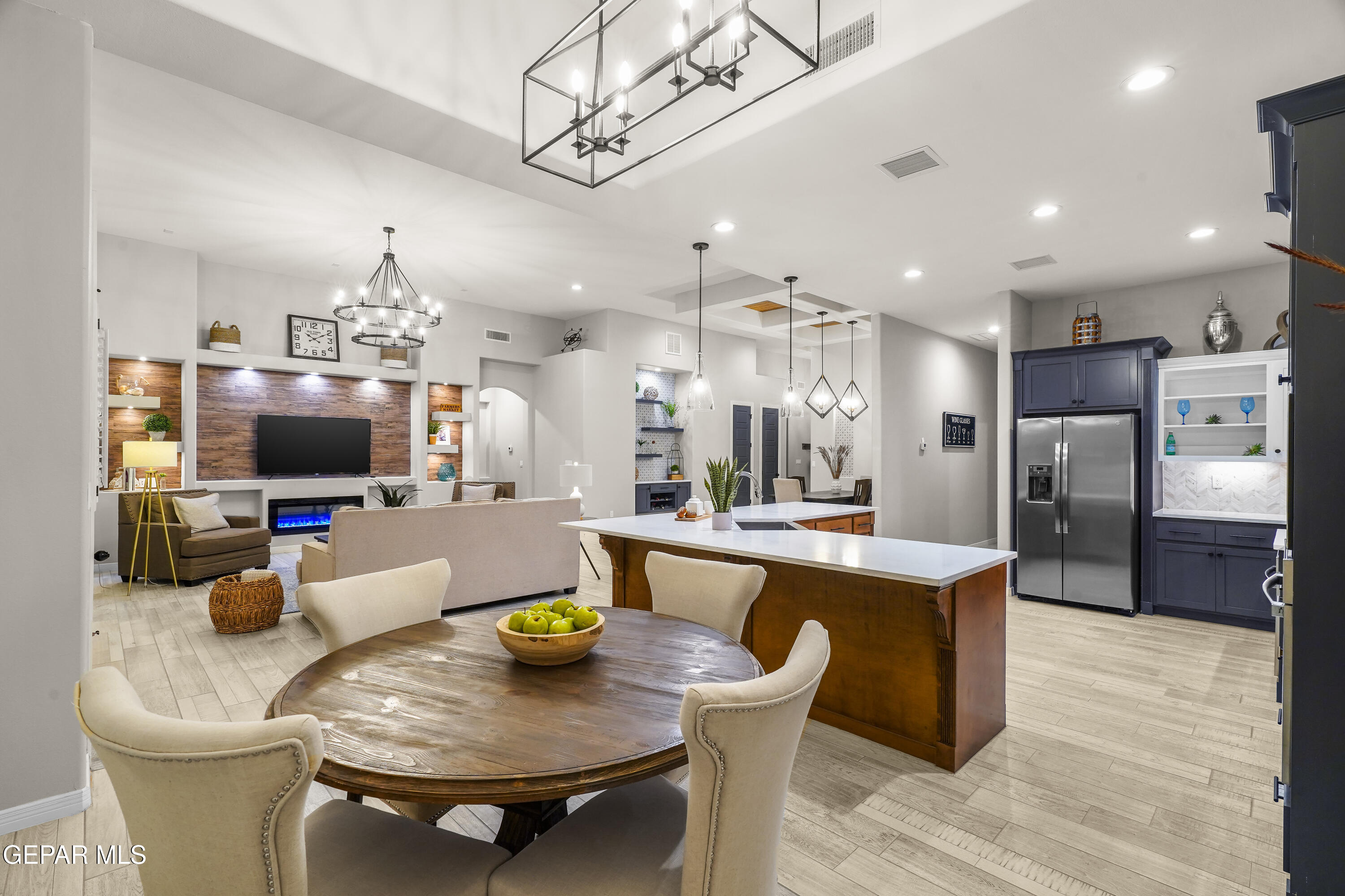 320 Emerald Rise Drive El Paso, TX 79928 - Photo 14 of 29 a kitchen with stainless steel appliances kitchen island granite countertop a dining table and chairs