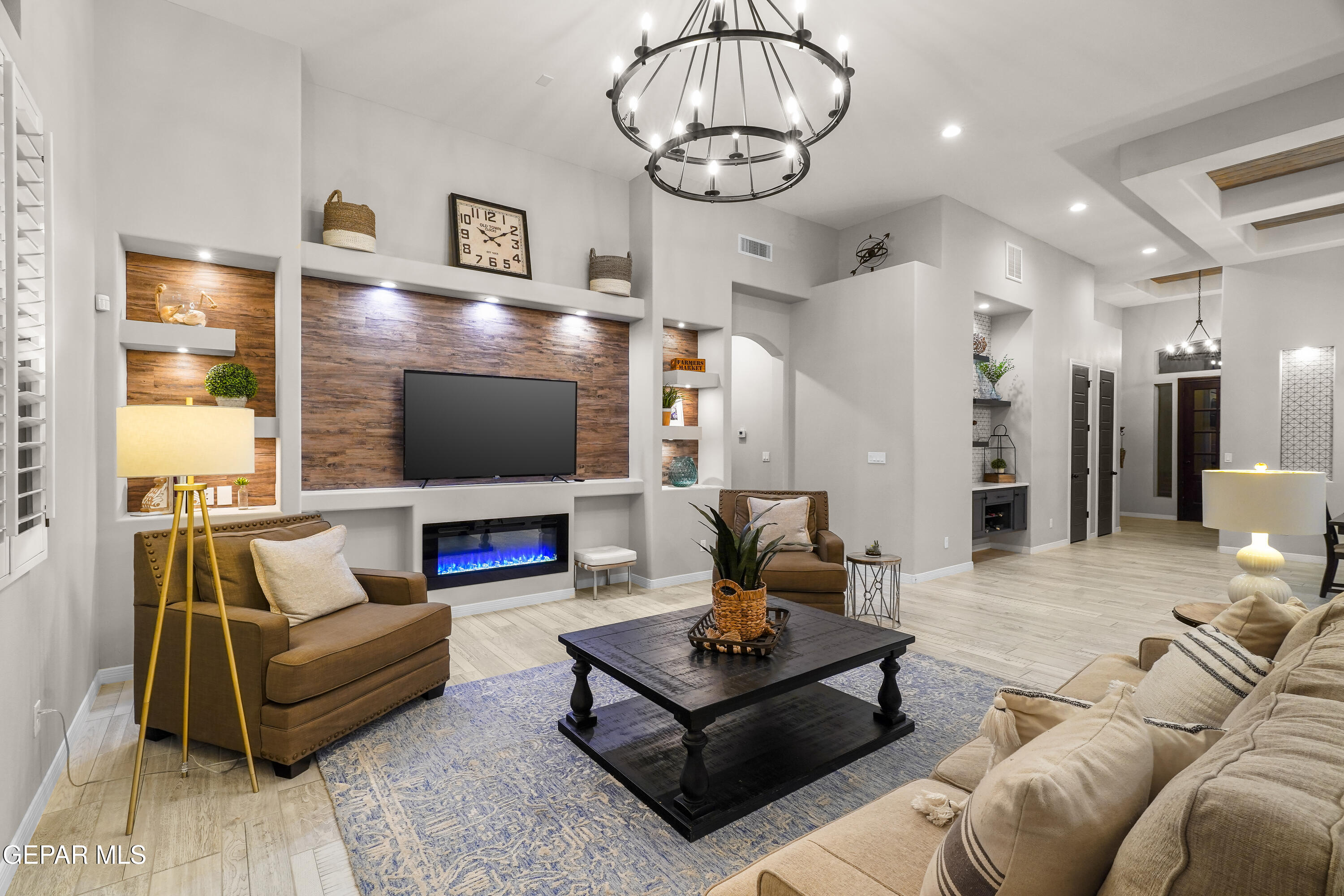 320 Emerald Rise Drive El Paso, TX 79928 - Photo 16 of 29 a living room with furniture a flat screen tv and a fireplace