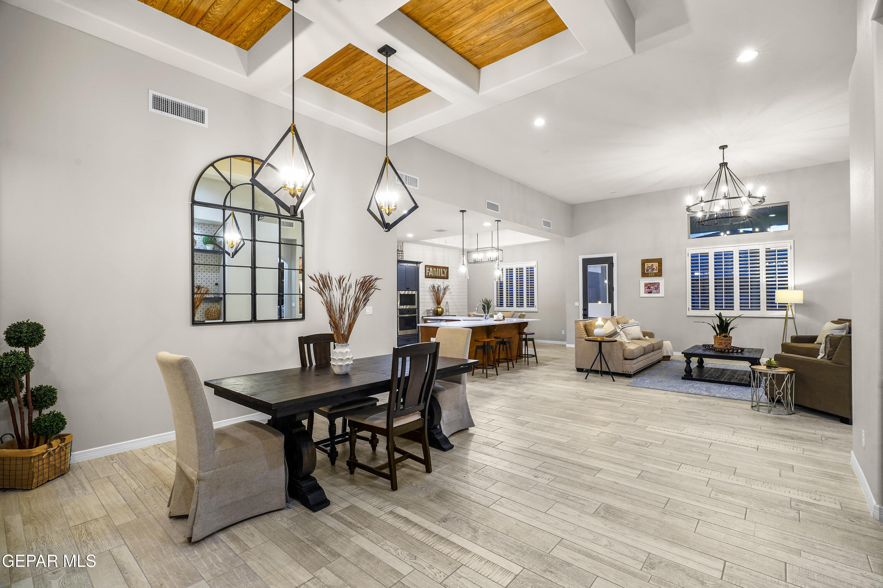 320 Emerald Rise Drive El Paso, TX 79928 - Photo 3 of 29 a living room with furniture a chandelier and a wooden floor