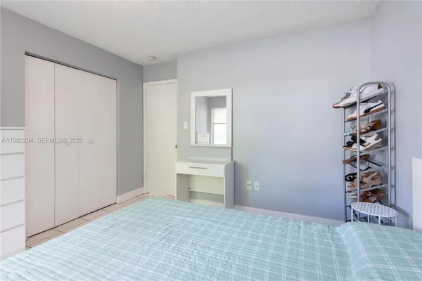 a bathroom with a sink a toilet and shower curtain