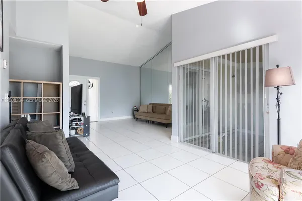 a kitchen with refrigerator and cabinets